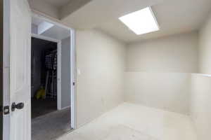 Spare room featuring unfinished concrete floors