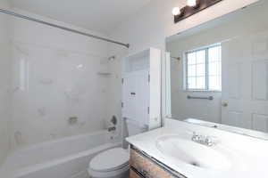 Bathroom featuring bathing tub / shower combination and vanity