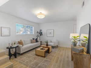 Living area with wood tiled floors
