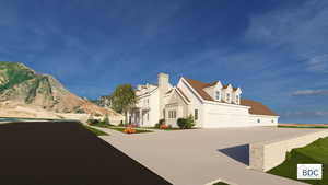 View of front of house with driveway and a garage