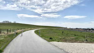 View of asphalt road with a view of countryside