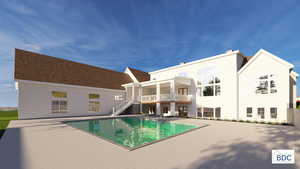 Back of property featuring an outdoor pool, a patio, and a balcony
