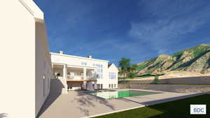 Outdoor pool featuring a patio area, a mountain view, and a balcony