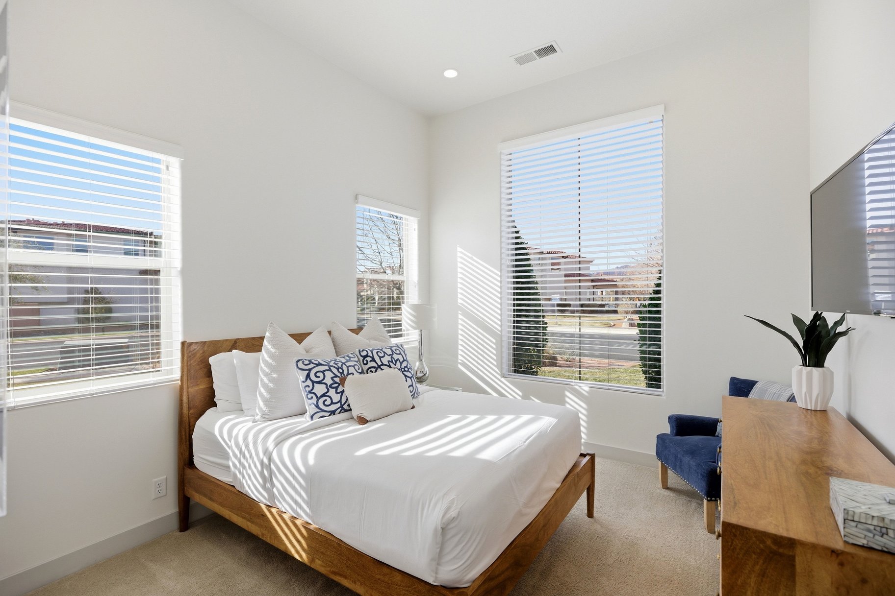 Bedroom featuring light colored carpet and baseboards
