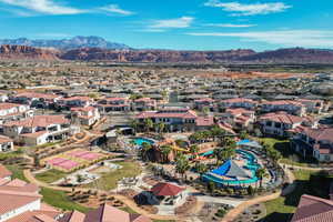 Aerial perspective of suburban area with a mountain backdrop
