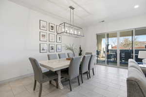 Dining area featuring suspended lighting and baseboards