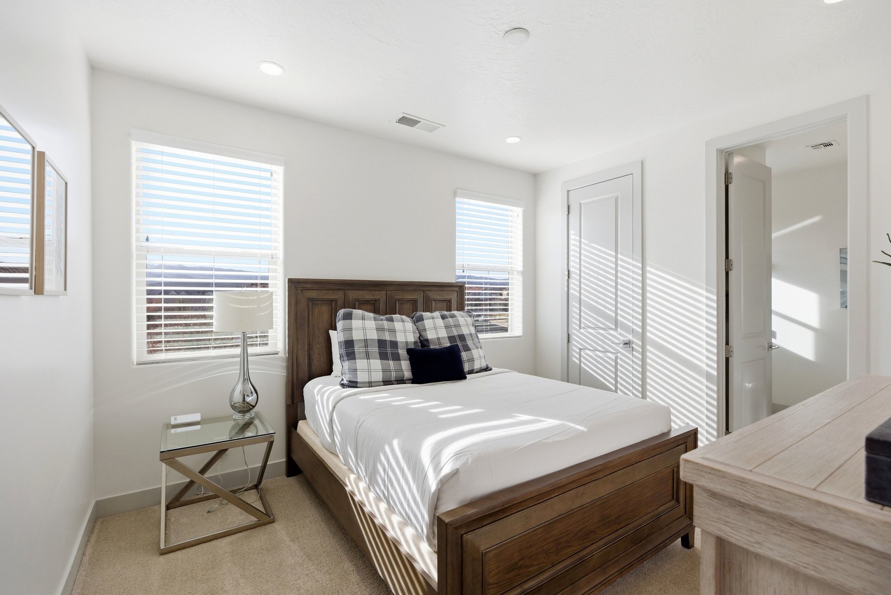 Bedroom with light carpet and a closet