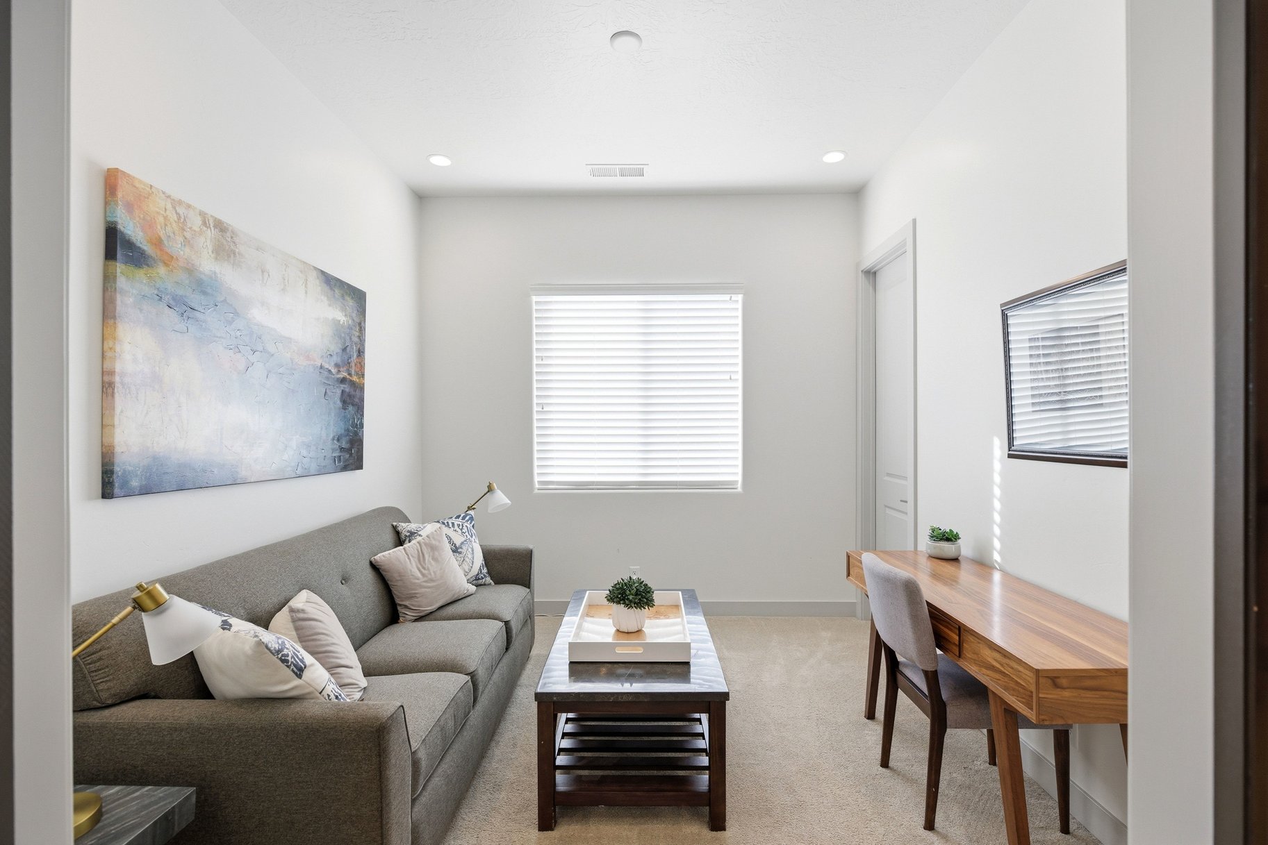 Living room with carpet flooring and recessed lighting