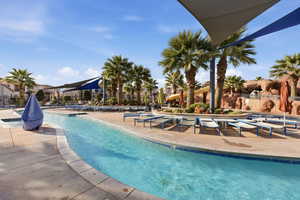 Community pool featuring a patio