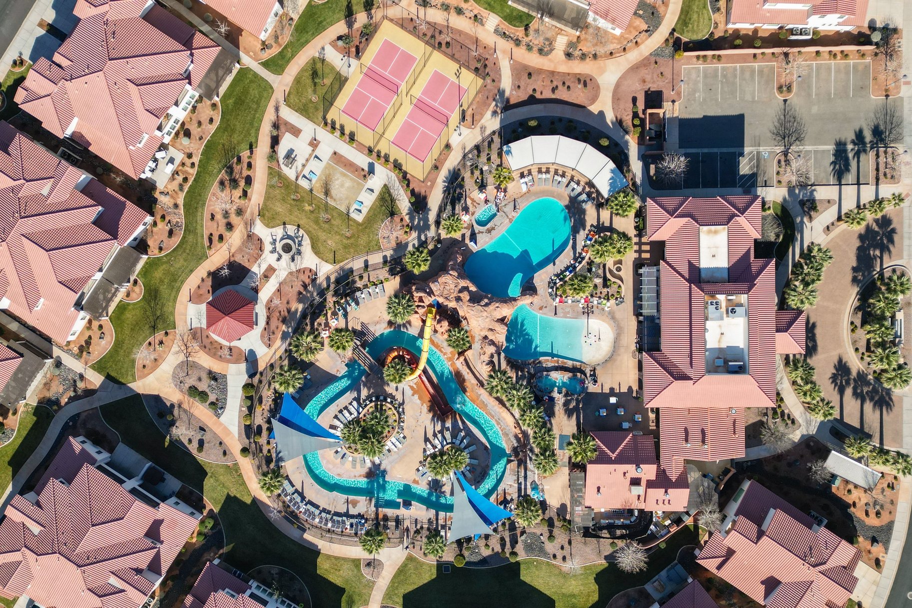 Aerial overview of property's location with a pool area