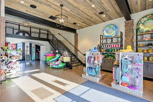 Game room with arched walkways, a high wooden ceiling, recessed lighting, and french doors