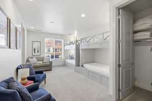 Bedroom featuring light carpet and recessed lighting