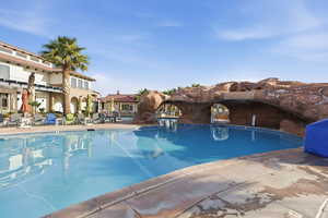 Community pool featuring a patio area