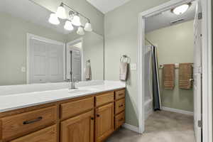 Full bathroom with vanity and shower / bath combination with curtain