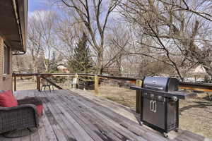 Wooden deck featuring grilling area