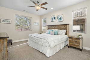 Primary Bedroom with carpet flooring, ceiling fan, and recessed lighting