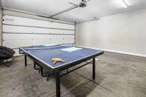 Playroom featuring a garage and concrete floors