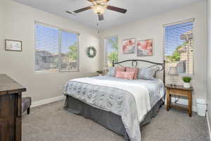 Casita Bedroom featuring a ceiling fan and light carpet