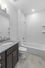 Full bathroom with bathtub / shower combination, vanity, recessed lighting, and light tile patterned floors
