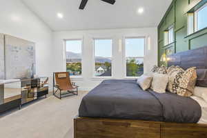 Bedroom with lofted ceiling, a mountain view, ceiling fan, carpet flooring, and recessed lighting