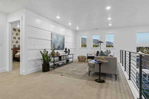 Living room featuring carpet floors, recessed lighting, and a mountain view