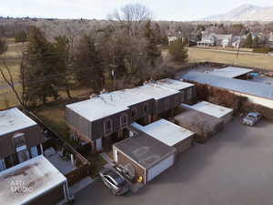 Aerial perspective of suburban area featuring a mountain backdrop