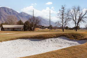 Surrounding community with a mountain view and view of golf course