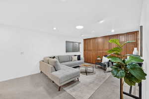 Basement Family Room with recessed lighting and light carpet