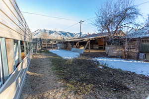 View of yard with an outbuilding and a mountain view