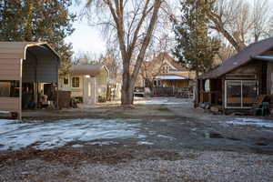 View of yard with a sunroom