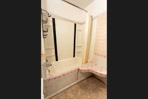 Bathroom with shower / tub combo with curtain