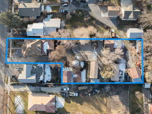 Aerial view of residential area with property parcel outlined