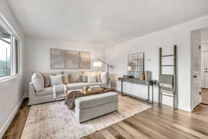 Living area featuring wood finished floors and baseboards