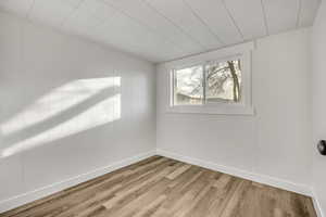 Spare room with wood finished floors and baseboards
