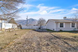 View of home's exterior featuring a mountain view and a central AC unit