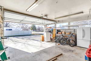Garage featuring freestanding refrigerator
