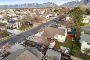 Aerial perspective of suburban area with a mountain backdrop