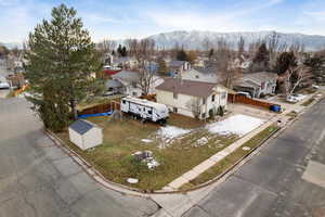 Aerial view of residential area featuring a mountainous background