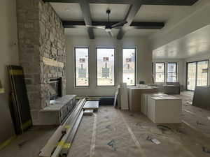 Family room with fireplace next to kitchen