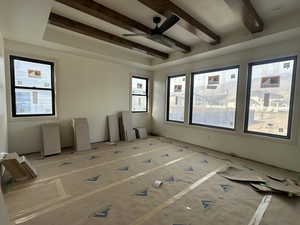 Primary Bedroom - Recessed ceiling and stained beams.
