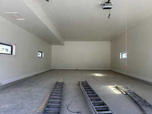 Garage featuring a garage door opener