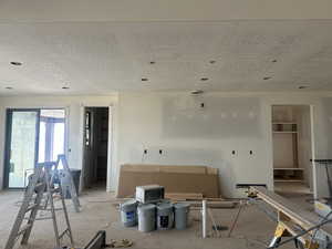 Kitchen area with exit to mudroom through garage and exit to covered deck