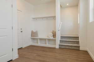Mudroom with wood finished floors and recessed lighting