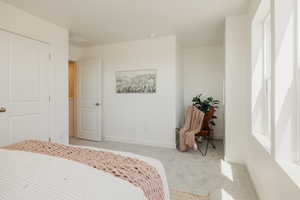 Carpeted bedroom with baseboards
