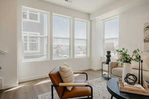 Sitting room with light wood finished floors and baseboards