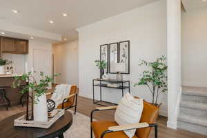 Living room with recessed lighting and light wood finished floors