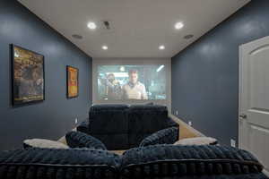 Cinema room featuring recessed lighting