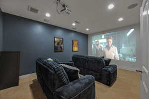 Cinema with light carpet and recessed lighting