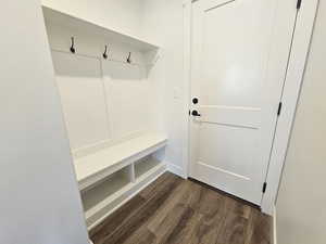 Mudroom featuring dark wood-type flooring
