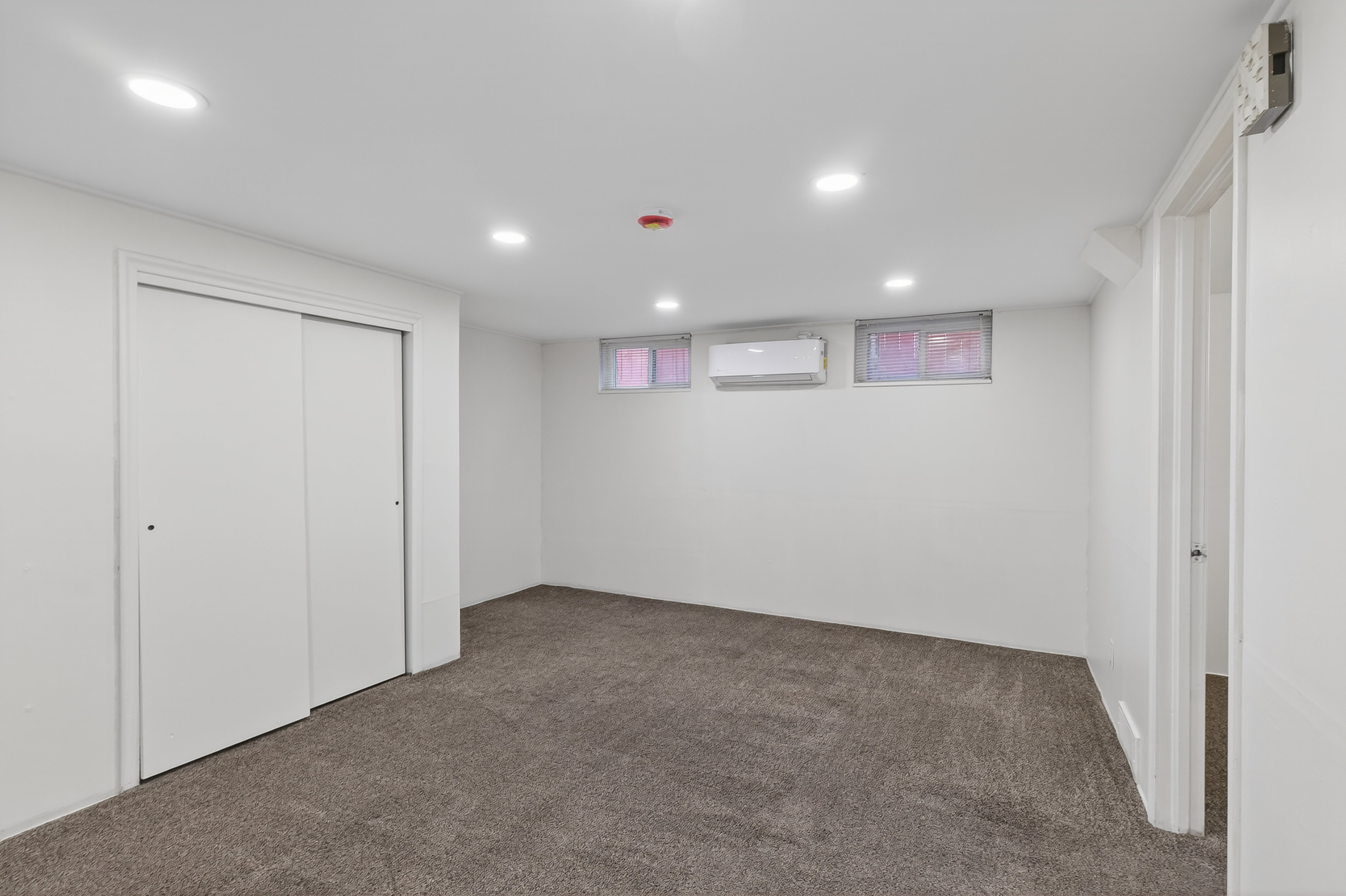Unfurnished bedroom with recessed lighting, carpet flooring, and a closet